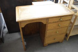 A knee hole desk/dressing table with four drawers