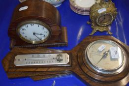 An oak cased barometer and two mantel clocks