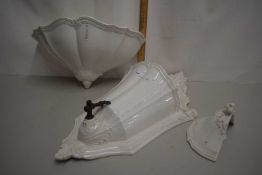 An Italian porcelain wall mounted water fountain and accompanying basis