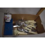 A box of modern cutlery and other items