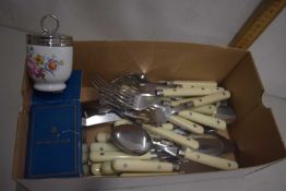 A box of modern cutlery and other items