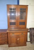 Late Victorian oak side cabinet with glazed top section over a base with drawers and cupboards