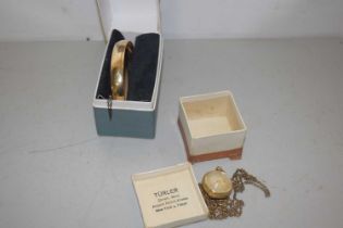 Rolled gold bangle together with a small bulleyes pendant watch the face marked Turler