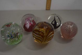 Five various paperweights to include Caithness editions