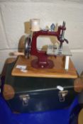 An Essex miniature sewing machine with case