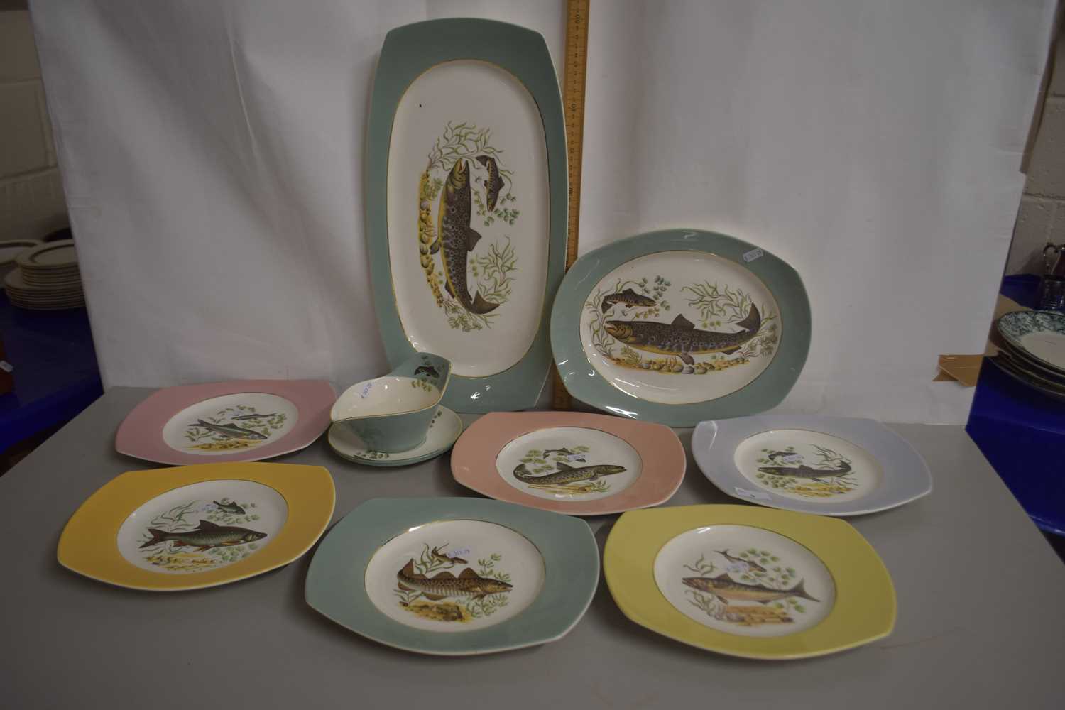 A collection of fish decorated plates