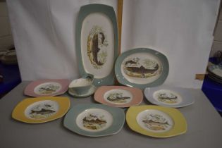 A collection of fish decorated plates