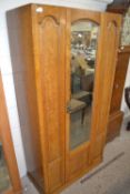 Small early 20th Century oak wardrobe with single mirrored door, 88cm wide