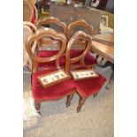 A set of four late Victorian balloon back dining chairs