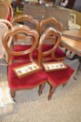 A set of four late Victorian balloon back dining chairs