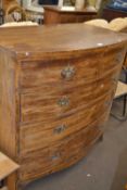 A bow front chest of drawers of two short and three long