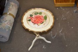 A floral decorated cream and gilt painted wine table