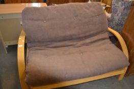 A two seater futon style sofabed