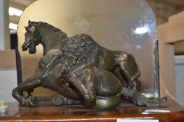 Early to mid 20th Century lamp of bronzed horse and lion with glass back