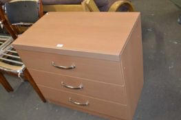 A three drawer chest of drawers