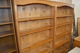 A pine double bookcase, approx 182cm wide