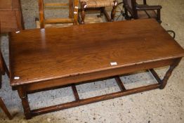 Reproduction oak coffee table on stretcher base, 122cm wide
