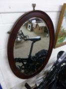 Edwardian mahogany framed oval bevelled wall mirror