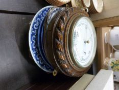 An oak cased wall mounted barometer and a quantity of assorted dinner plates and others
