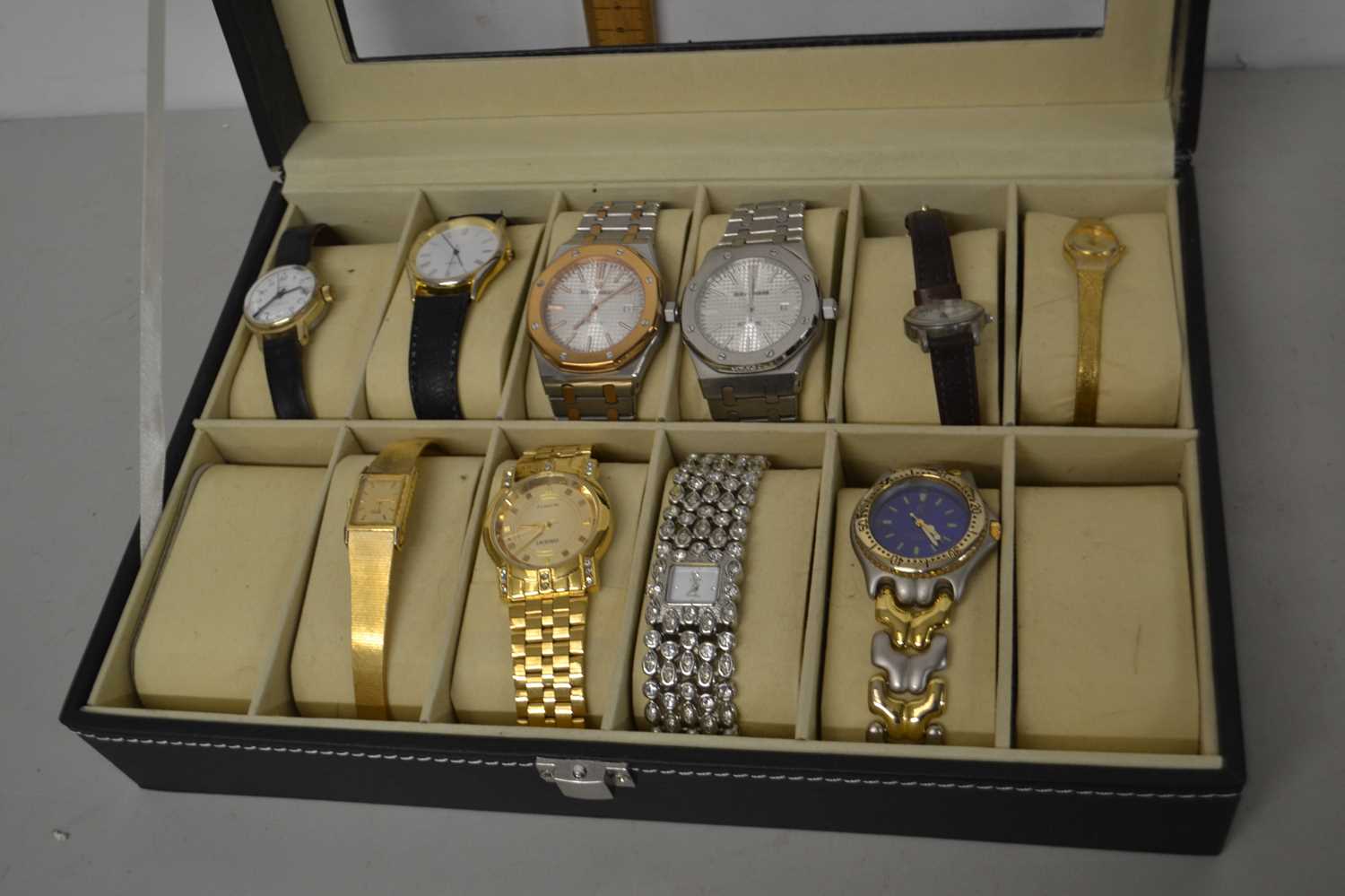 Display case of modern ladies and gents wristwatches
