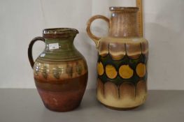 A Wattisfield jug together with a further German pottery vase (2)