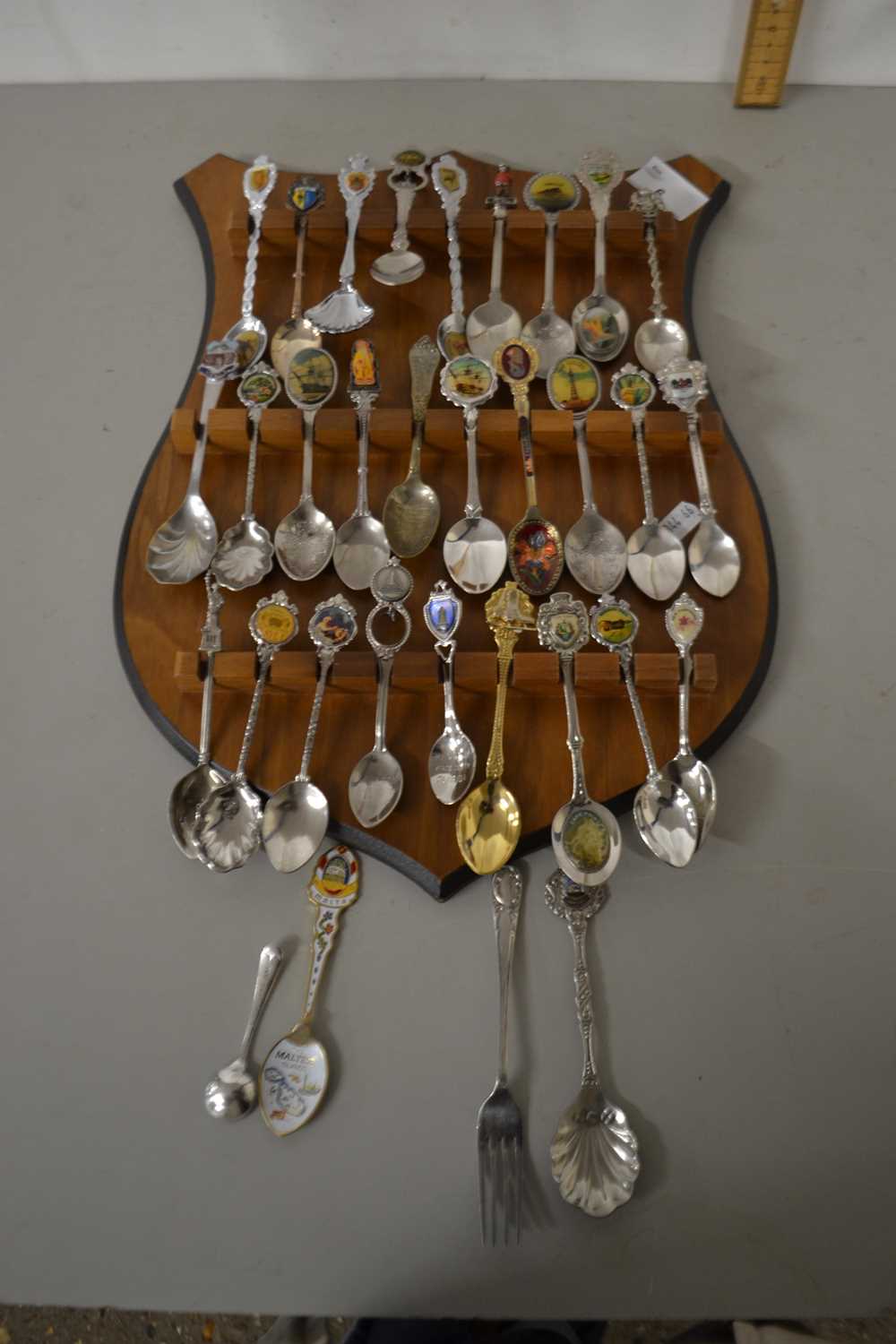 A display rack of crested spoons