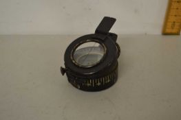 A vintage military compass marked T.G Co Ltd, London, 112310 1941 MK11