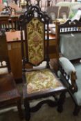 Gothic revival oak hall chair with floral upholstered seat and back