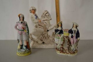 A Staffordshire figure on horseback together with two others