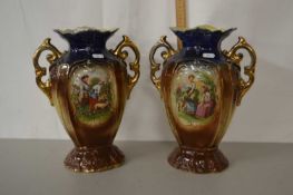 A pair of early 20th Century lustre finish double handled vases