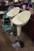 Pair of retro chrome base bar stools