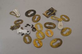 Box of various mixed brass escutcheons and similar items