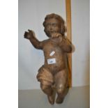 A contemporary carved figure of a child with chain hanging suspension