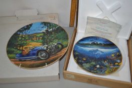 Two boxed collectors plates