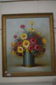 A contemporary oil study of a vase of flowers, indistinctly signed, gilt framed