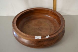 A large turned wooden fruit bowl
