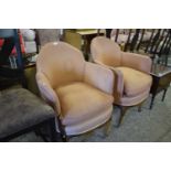 A pair of early 20th Century tub armchairs