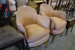 A pair of early 20th Century tub armchairs