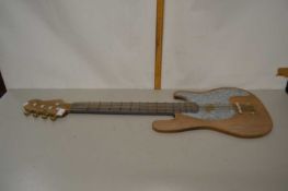 A wall ornament formed as an electric guitar