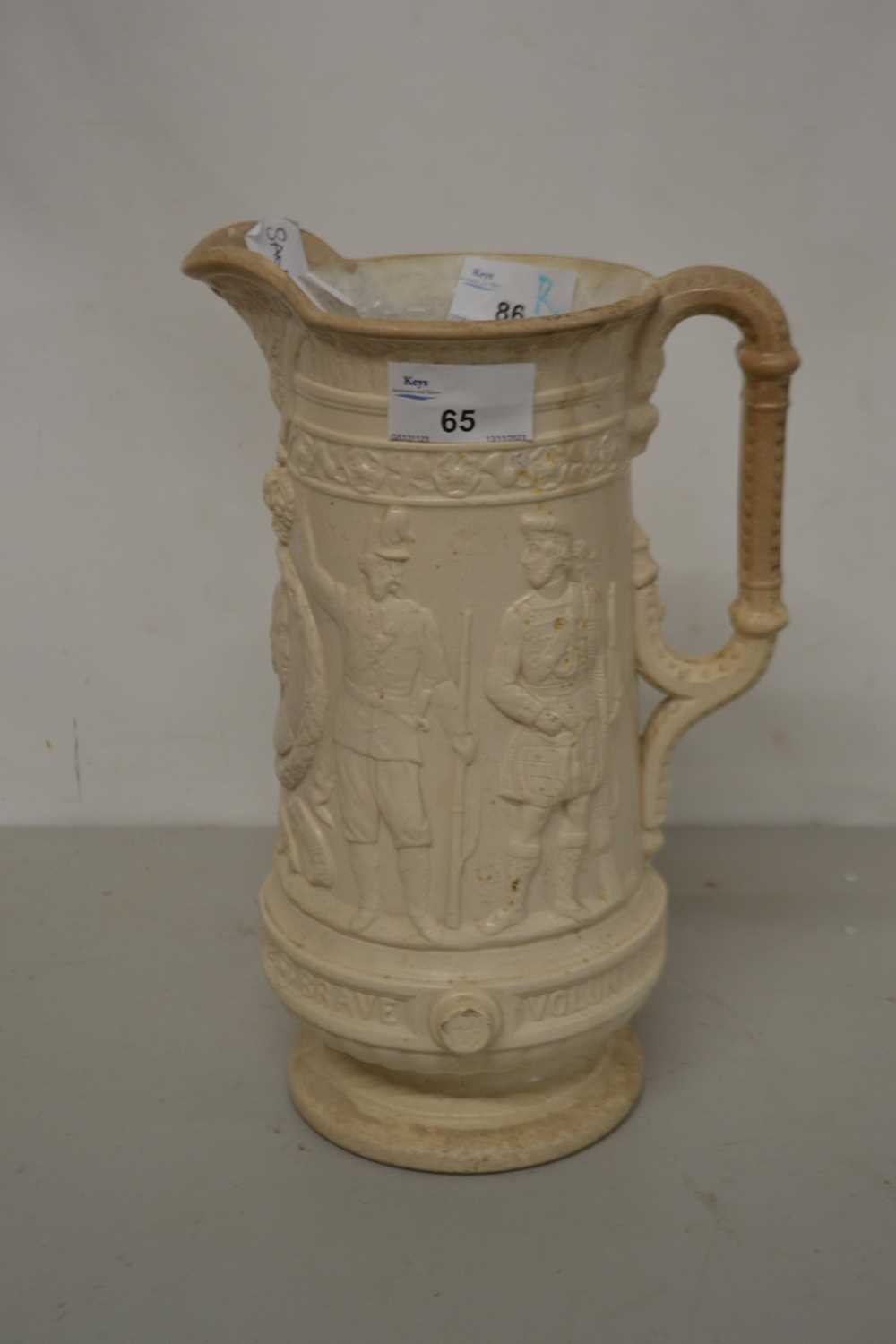 A vintage Sandford jug decorated with Queen Victoria's head and marked Our Army and Navy Brave