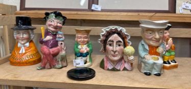 A quantity of character jugs and other figures similar