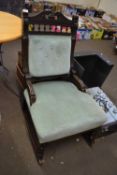 Green upholstered rocking chair