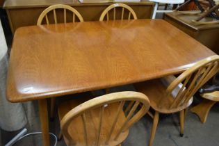 A Priory Ercol style dining table and four chairs