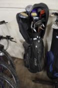 Golf caddy and a quantity of clubs
