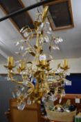 A five branch gilt and glass drop ceiling light