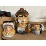 A Sherlock Holmes style tobacco jar together with a character jug The Tramp and another of a lady (