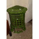 A decorative continental green enamel finish stove with pierced floral decoration