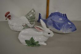 A group of three modern porcelain tureens formed as a rabbit, a chicken and a fish
