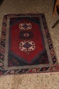 A small Middle Eastern wool floor rug