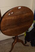 A Georgian oak tripod table with flip top